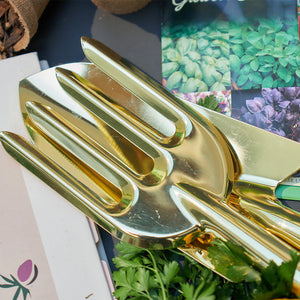 Close up image of gold garden tools