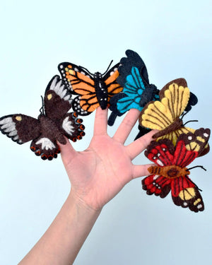 Image of hand with butterfly finger puppets on fingers