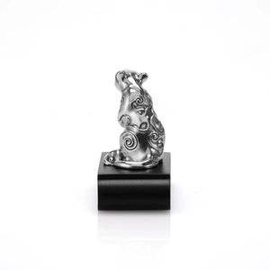 Rear view image of Chinese Zodiac Rat Figurine by Royal Selangor, showing pewter rat figurine on black stand on white background.