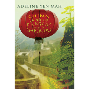 Image of front cover of book titled China Land of Dragons and Emperors, red lantern on background of great wall of China.
