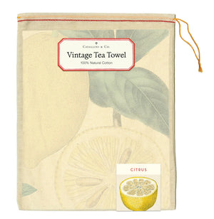 Cavallini & Co. tea towel packaging with citrus fruit illustration and 100% natural cotton label.