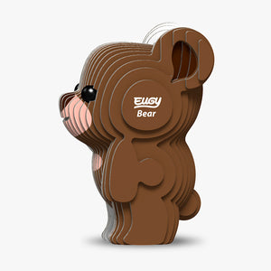 Side view image of EUGY Bear, showing brown bear made from layers of cardboard stuck together on white background.