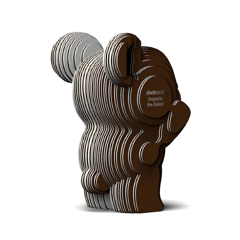 Rear image of EUGY Bear, showing brown bear made from layers of cardboard stuck together on white background.