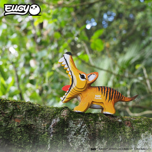 Side view image of EUGY Tasmanian Tiger on log with moss on green background.