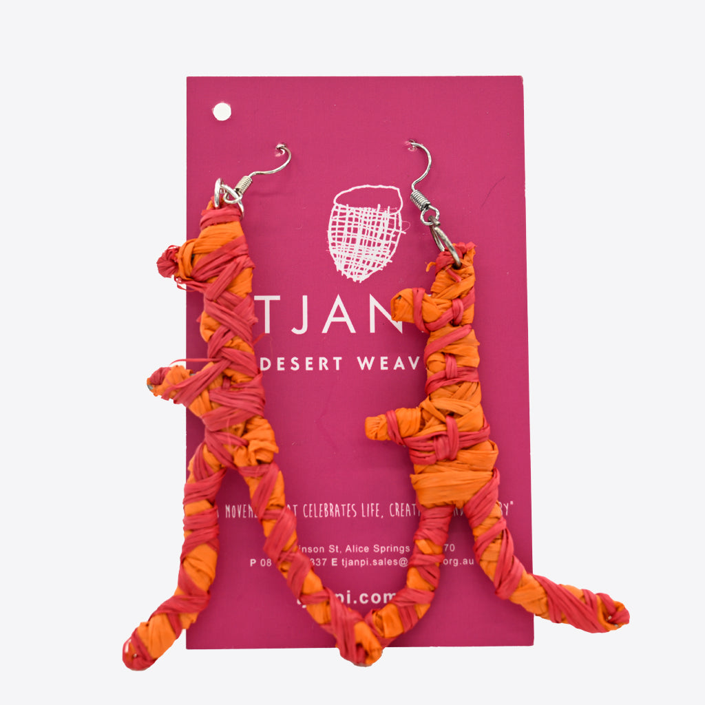 Image of orange rafia earrings by Tjanpi Weavers