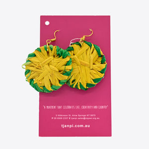 Image of yellow and green rafia earrings by Tjanpi Weavers