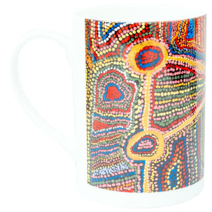 Side view image of Ceramic mug printed with 2005 artwork (untitled) by Estelle Hogan from the Spinifex Arts Project.