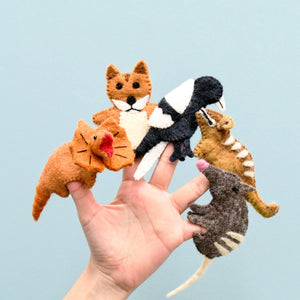 Image of Australian animal finger puppets on hand with blue background
