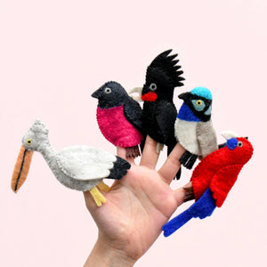 Image of Australian Bird Finger Puppets on hand on light pink background