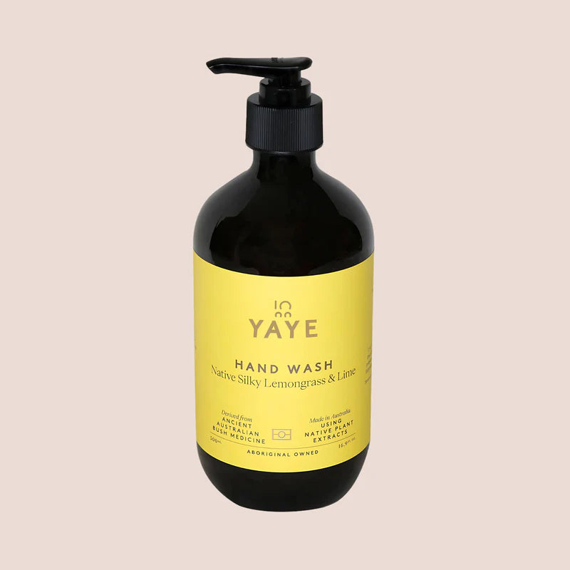 Image of front of Yaye hand wash with yellow label on light pink background