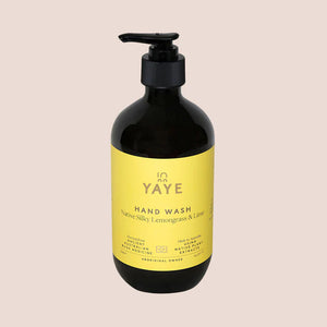 Image of front of Yaye hand wash with yellow label on light pink background