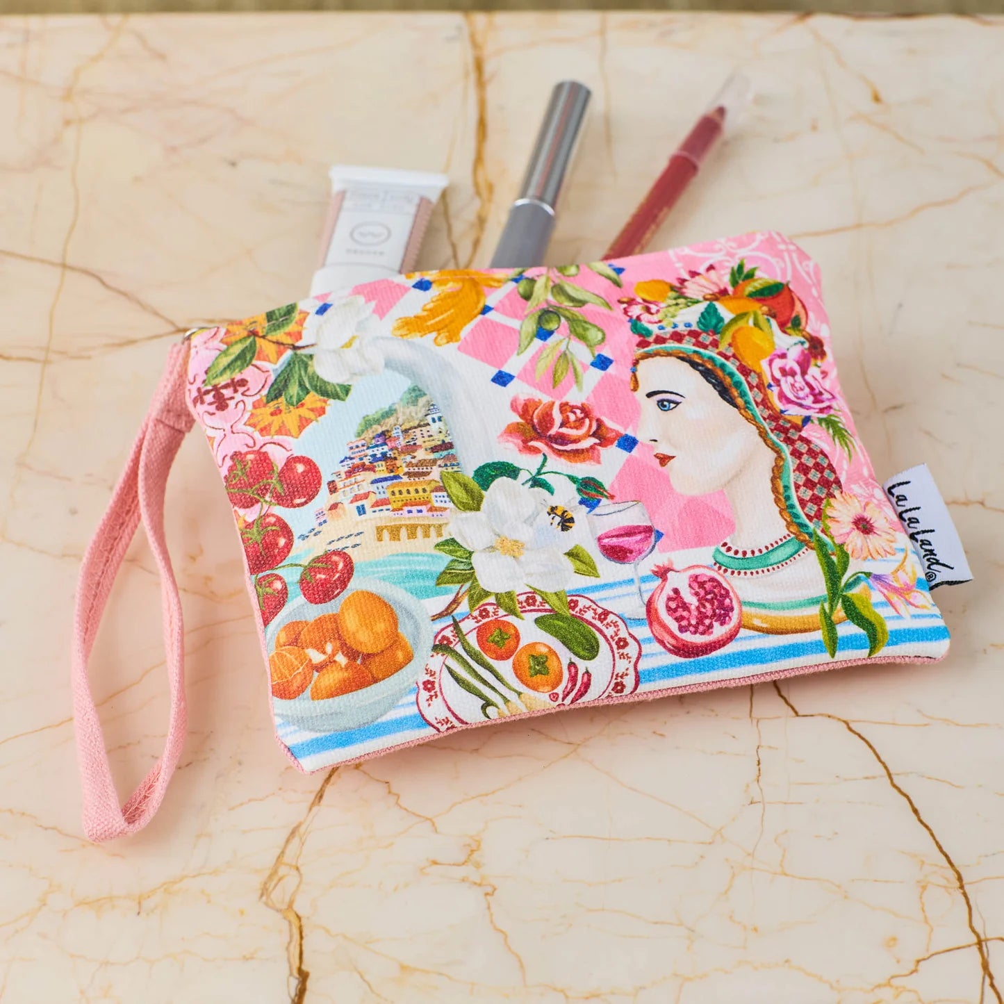 Italian summer coin purse with vibrant design of a woman, fruits, flowers, and a scenic coastal village.