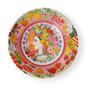 Italian summer salad bowl with central portrait, fruits, flowers, and vibrant decorative patterns.