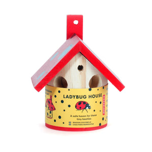 From view image of wooden lady bug house with red roof in packaging