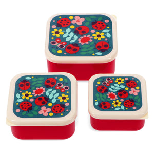 Image of three red snack boxes with ladybird design on lid