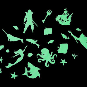 Green Glow Shapes on black background showing a pirate, ship, narwhal, octopus, shark, coral and fish