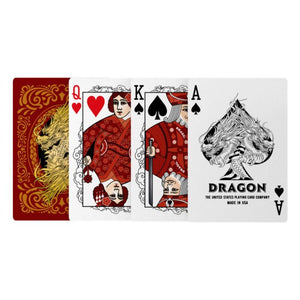 Image of four Bicycle Dragon playing cards displayed in a row, showing the ornate card back with gold dragon artwork, Queen of Hearts, King of Spades, and Ace of Spades with a fierce black dragon illustration and the text "Dragon – The United States Playing Card Company – Made in USA.