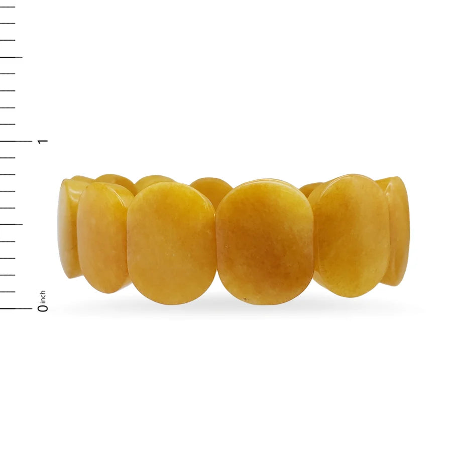 Side view image of yellow Jade oval shaped beaded bracelet on white background.
