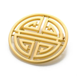 Image of Shou symbol brooch, round gold cut out symbol on white background.