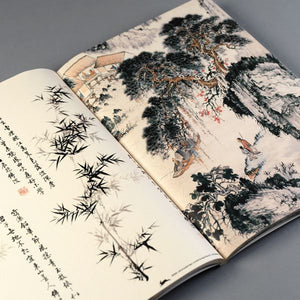 Image of Gift and Creative Papers Book – Chinese Art Edition, showing open book with Chinese landscape artworks.