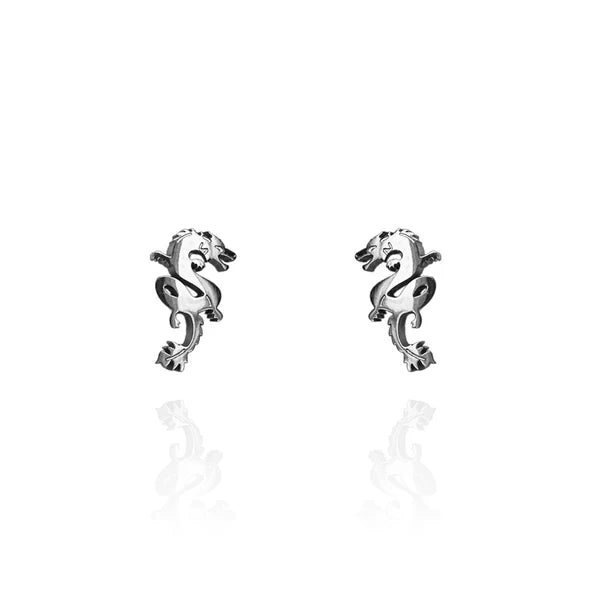 Image of a pair of silver-tone stud earrings shaped like stylized Chinese dragons, featuring intricate detailing and a coiled body design, displayed against a white background with faint reflections.