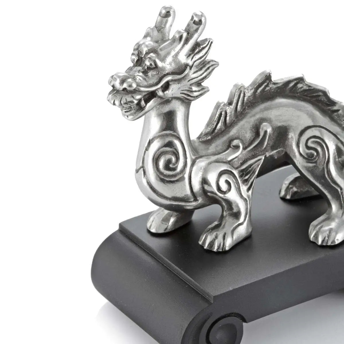 Close up image of Chinese Zodiac Dragon Figurine by Royal Selangor, showing silver metal dragon figurine on black stand on white background.