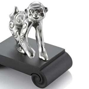 Close up image of Chinese Zodiac Monkey Figurine by Royal Selangor, showing silver monkey figurine on black stand on white background.