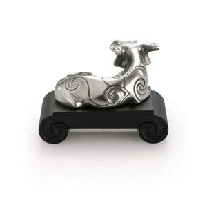 Rear view image of Chinese Zodiac Ox Figurine by Royal Selangor, showing ox figurine on black stand on white background.
