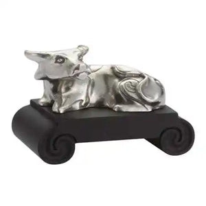 Image of Chinese Zodiac Ox Figurine by Royal Selangor, showing ox figurine on black stand on white background.