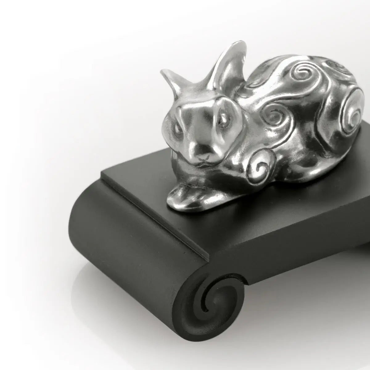Close up image of Chinese Zodiac Rabbit Figurine by Royal Selangor, showing silver rabbit figurine on black stand on white background.