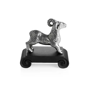 Side view image of Chinese Zodiac Ram Figurine by Royal Selangor, showing silver ram figurine on black stand on white background.