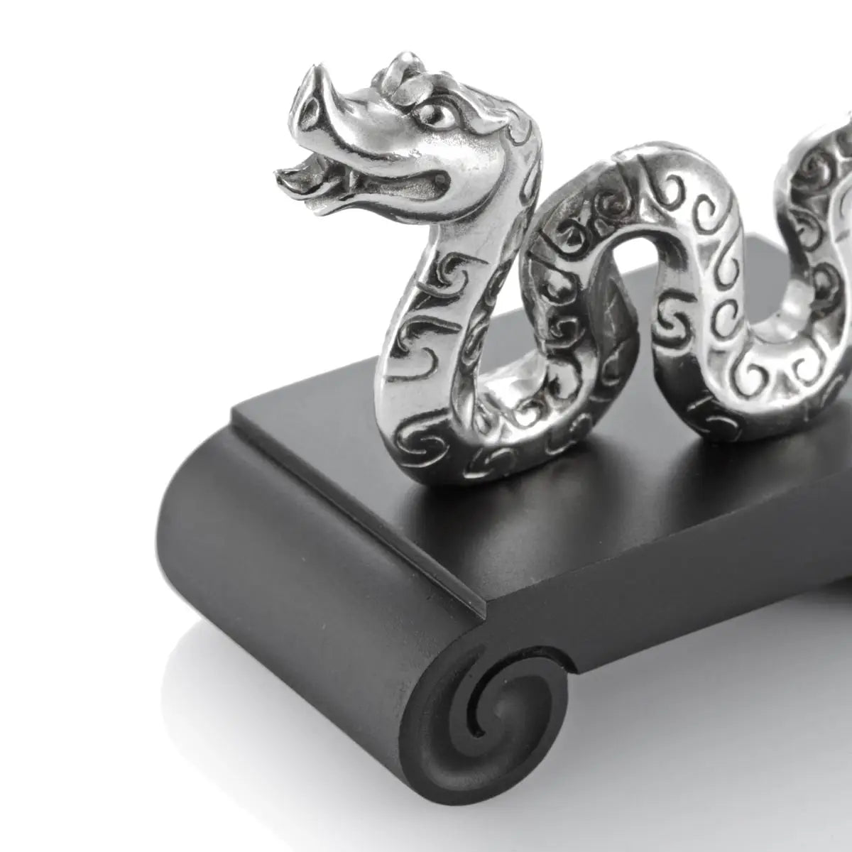 Close up image of Chinese Zodiac Snake Figurine by Royal Selangor, showing silver snake figurine on black stand on white background.