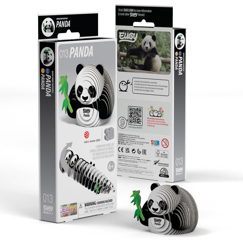 Image of black and white 3D Eugy panda model made of layered, recyclable cardboard, sitting upright and holding a green stick of bamboo, and packaging, against a white background.