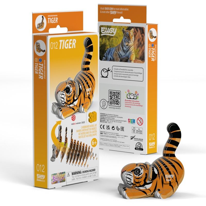 Side view image of Eugy Tiger, showing tiger model made form layers of cardboard in orange, black and white and packaging. Models paws are stretched out in front with bottom in the air and tail sticking up. White background.