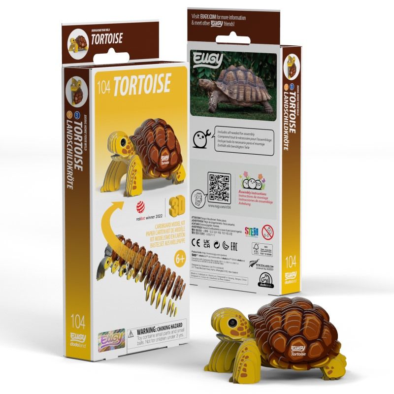 Image of Eugy Tortoise, showing tortoise with yellow legs and head and brown shell made from layers of cardboard, and packaging, on white background.