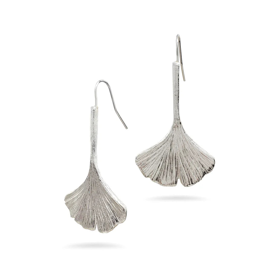 Image of ginkgo leaf shaped silver drop earrings on white background.