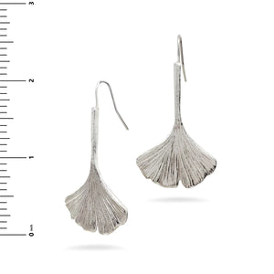 Image of ginkgo leaf shaped silver drop earrings on white background.