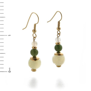 Image of pair of gold hanging earrings with three jade beads on white background.