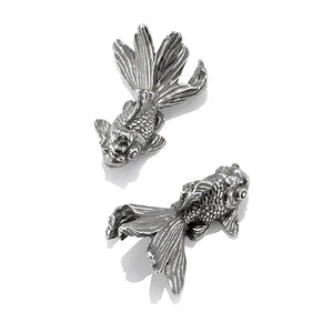 Top view image of pair of goldfish chopstick rests by Royal Selangor, showing two pewter goldfish shaped chopstick holders on white background.