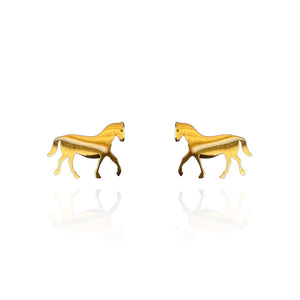 Image of a pair of gold-tone stud earrings in the shape of walking horses, featuring a smooth, reflective finish with slight shading for depth. Displayed on a white background with a faint mirrored reflection beneath each earring.