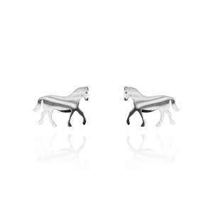 A pair of silver-tone stud earrings in the shape of walking horses, featuring a smooth, reflective finish with slight shading for depth. Displayed on a white background with a faint mirrored reflection beneath each earring.