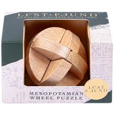 Image of boxed wooden brain teaser labeled "Mesopotamian Wheel Puzzle" from the Lost & Found collection, featuring a round, interlocking wooden structure inside dark green and white historical-themed packaging.