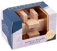 Image of boxed wooden brain teaser labeled "Roman Roads Puzzle" from the Lost & Found collection, featuring interlocking light wooden pieces inside blue and white packaging inspired by historical themes.