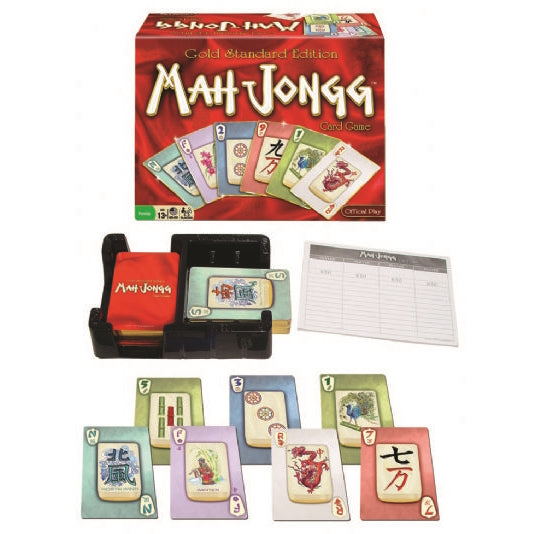 Image of Mah Jongg Gold Standard Edition card game set, featuring a red game box with illustrated cards on the front, a black plastic card holder tray with red and green cards, a score pad, and a variety of colorful Mah Jongg-themed playing cards laid out in front.