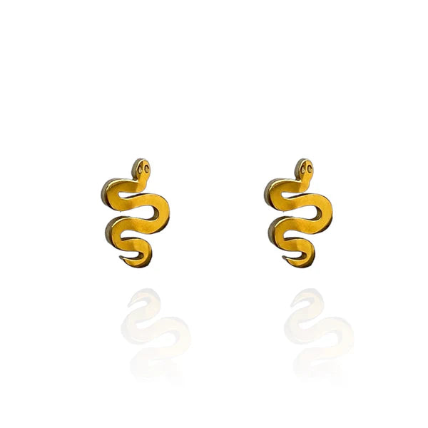 Image of a pair of gold-tone stud earrings shaped like stylized serpents with coiled bodies and small round eyes, displayed on a white background with a subtle mirrored reflection.