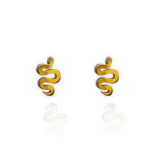 Image of a pair of gold-tone stud earrings shaped like stylized serpents with coiled bodies and small round eyes, displayed on a white background with a subtle mirrored reflection.