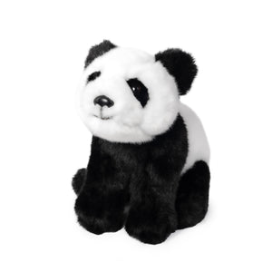 Image of Panda Cub Plush, showing black and white fluffy panda cub plush sitting with its font paws on the ground in front of its hind legs, on white background.