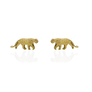 Image of a pair of gold-tone stud earrings shaped like walking snow leopards, featuring engraved spots and curved tails, displayed on a white background with a subtle reflection.