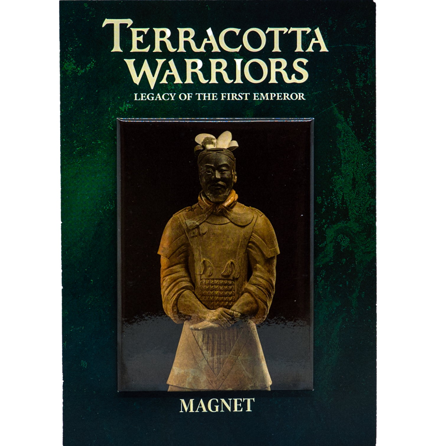 A magnet featuring a Terracotta Warrior figurine is displayed on a dark green card. The card has the text "TERRACOTTA WARRIORS" at the top, followed by "LEGACY OF THE FIRST EMPEROR" in smaller letters underneath. At the bottom of the card, it says "MAGNET". The figurine is dressed in traditional armor with intricate details and stands with hands clasped in front.
