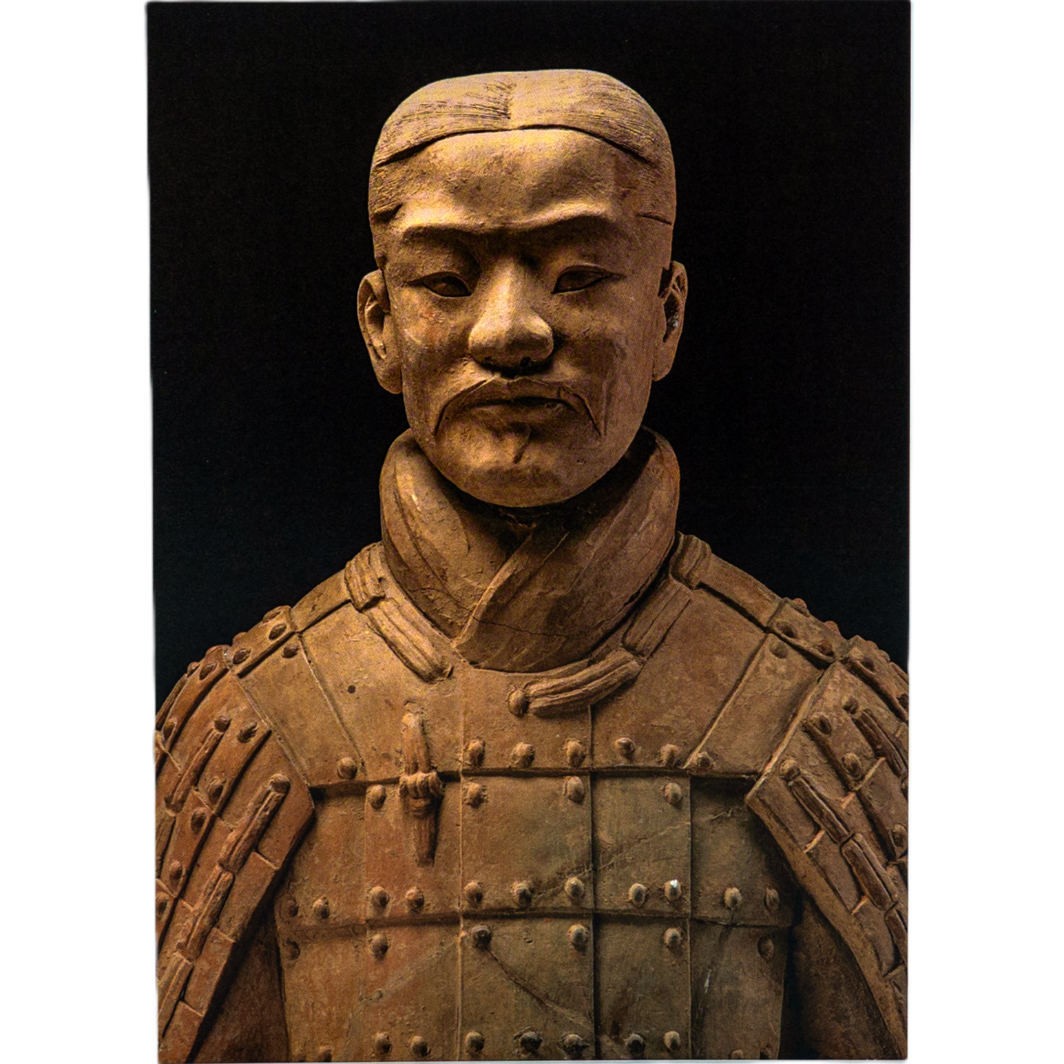 Notecard featuring a front-facing terracotta warrior statue with detailed armor and headpiece, set against a black background to highlight its features.